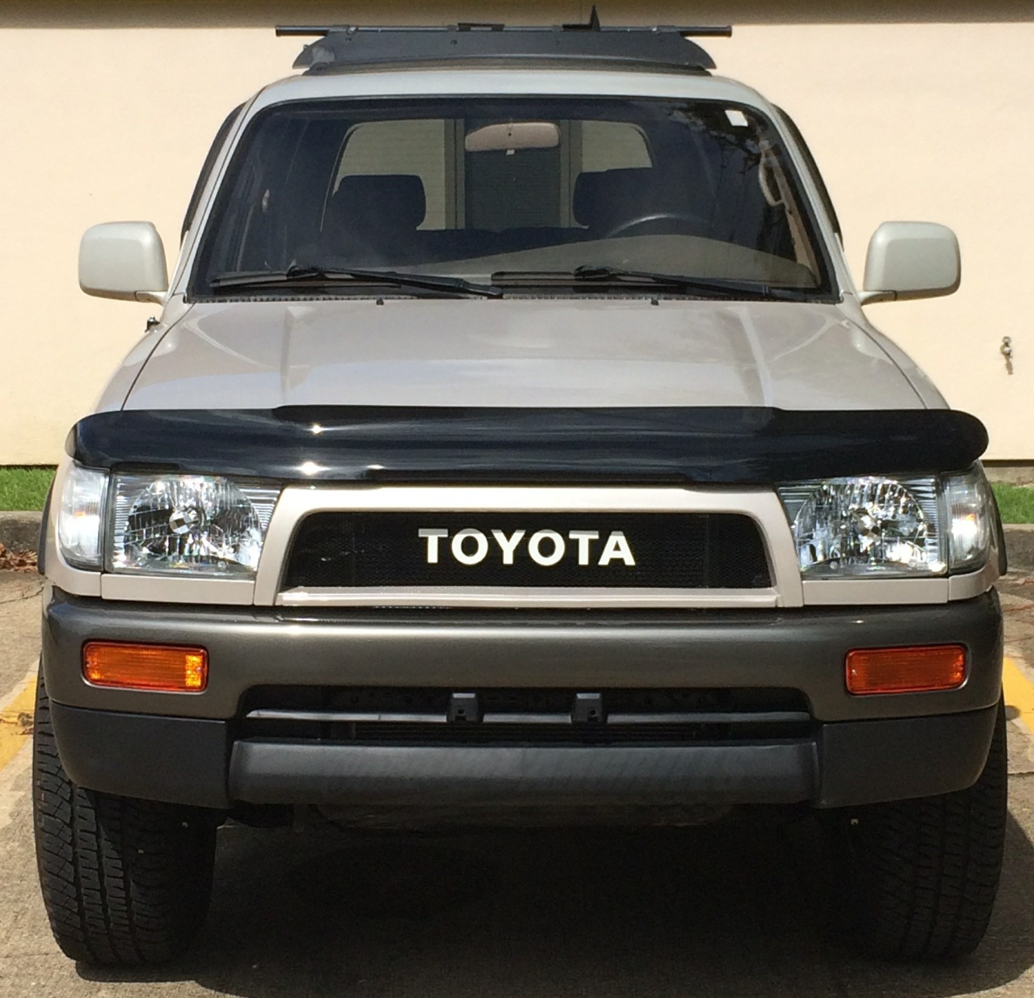 Revamp Your Ride: 3rd Gen Toyota 4Runner with Black Slotted Mesh Grille and Retro Toyota Emblem