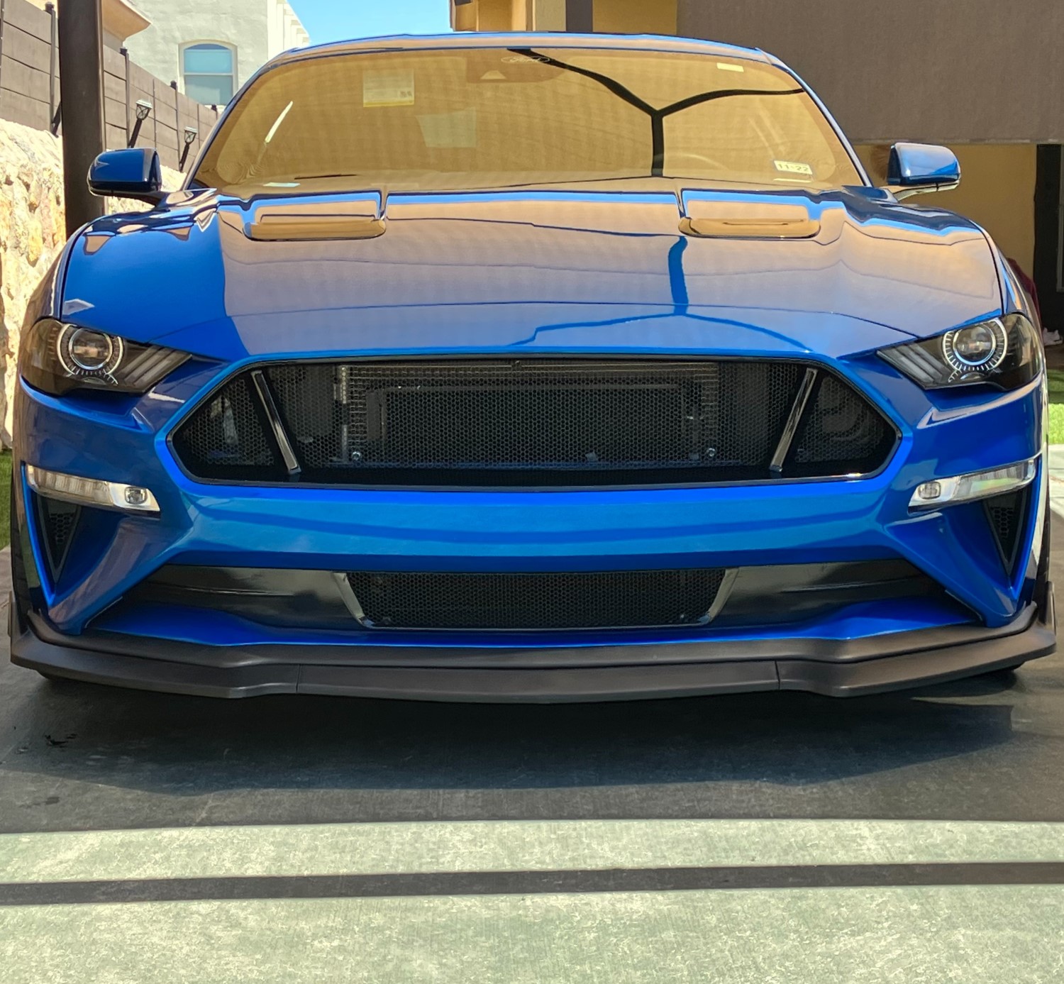Aggressive Style: Custom Black Grille Upgrade for Blue 6th Gen Mustang