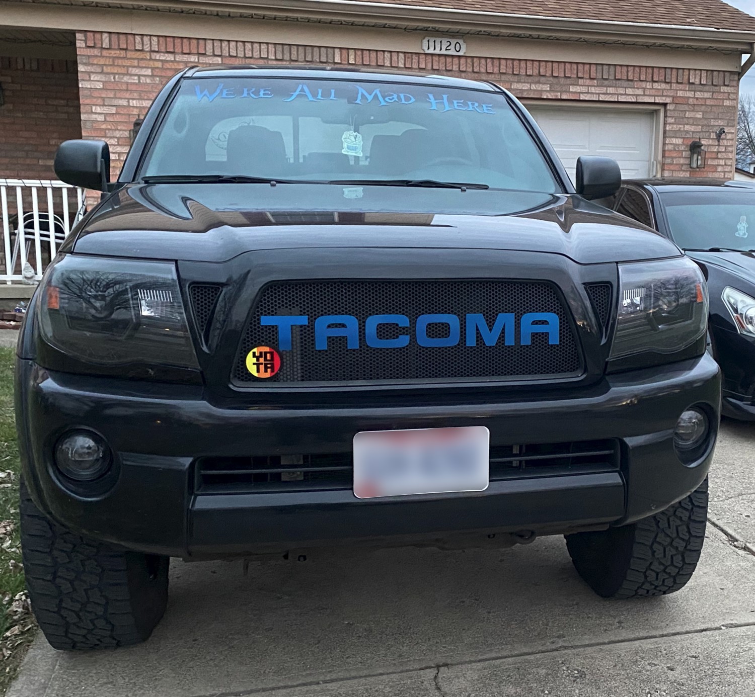 Custom Speedway Blue Toyota Tacoma Grille with Unique Emblem Design