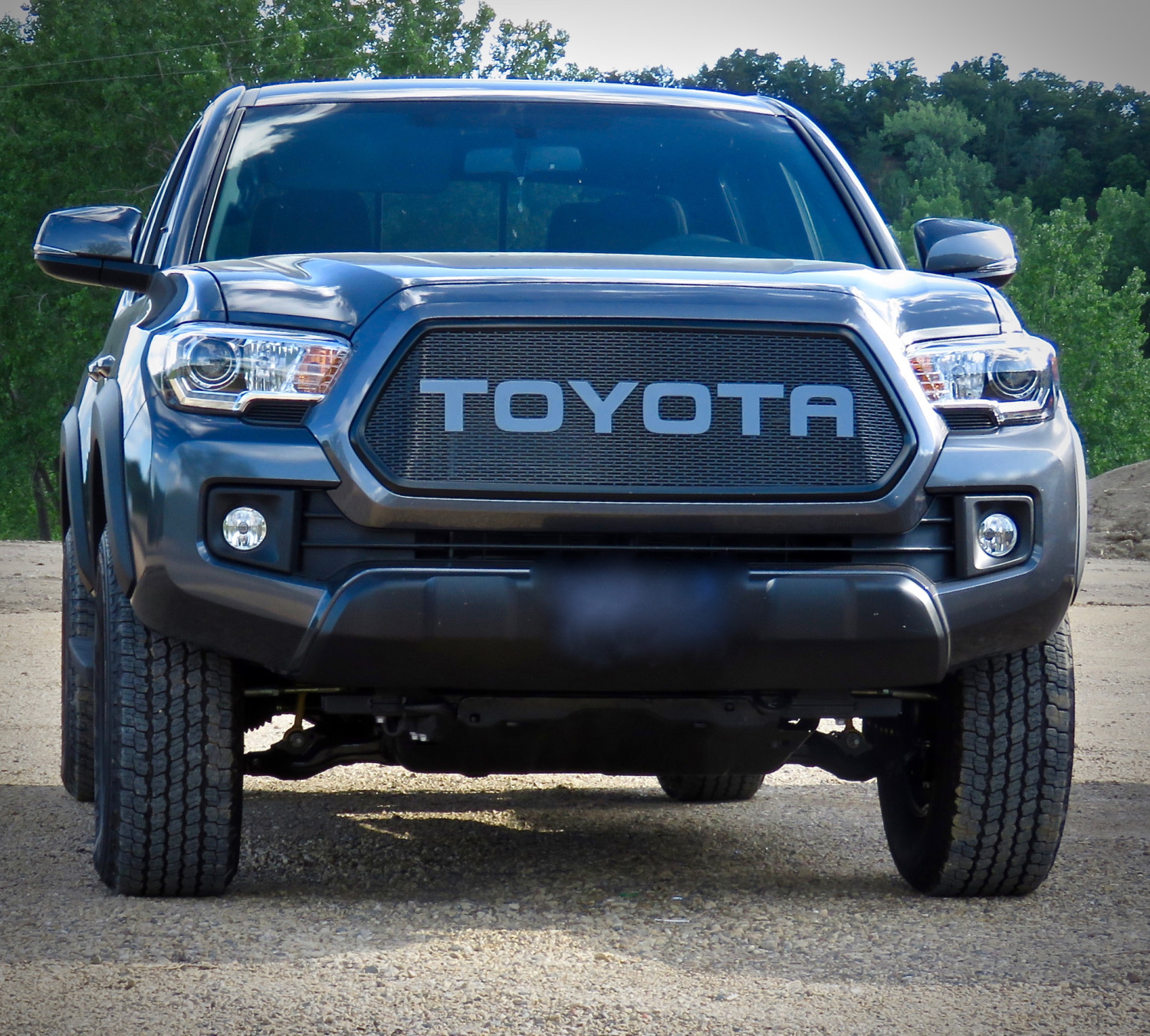Tacoma Transformation: Black Bezel, Slotted Mesh, and Color-Matched Letters