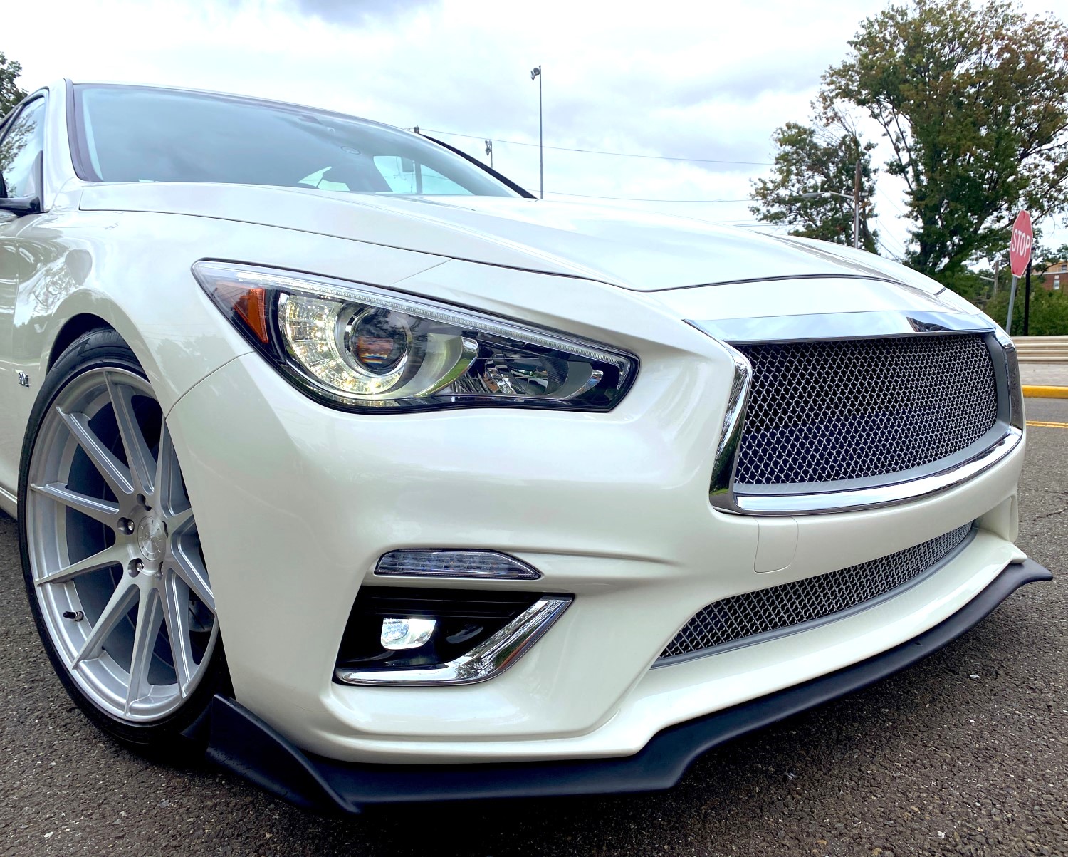 Upgrade Your Infiniti Q50's Style with a Silver Wire Cloth Grille and Chrome Bezel