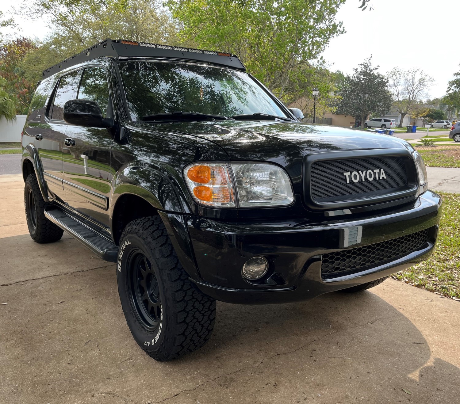 Upgrade Your First Gen Toyota Sequoia with a Sleek Flat Black Mesh Grille and White Toyota Emblem