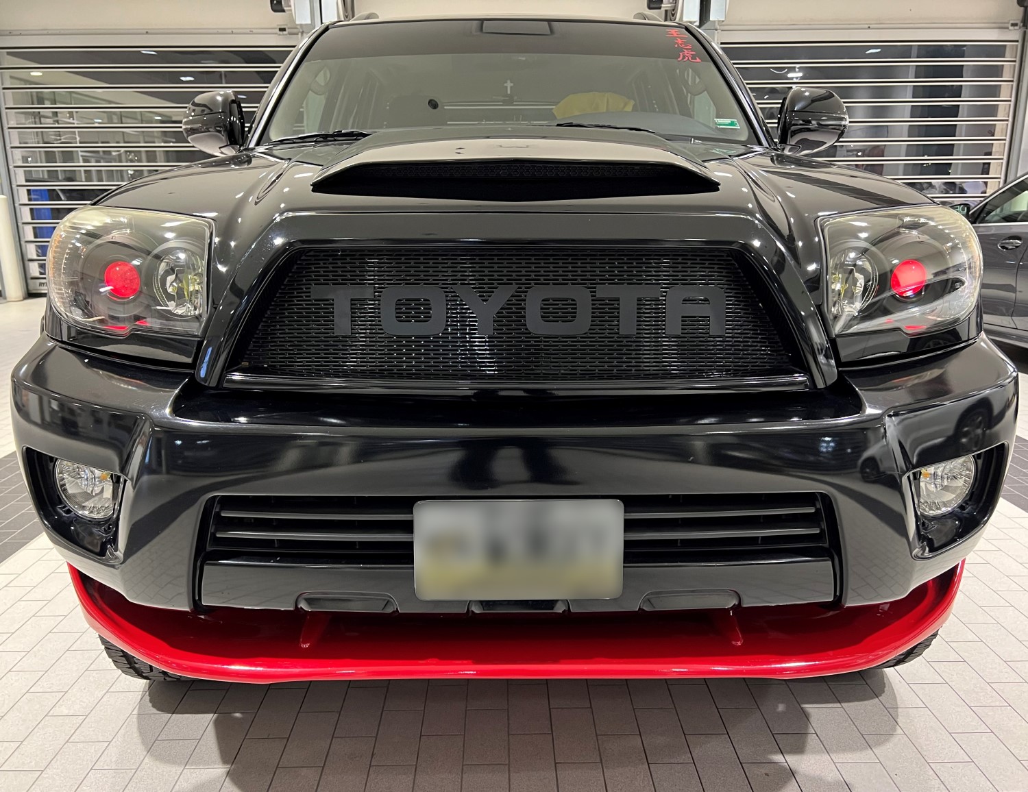 Sleek and Striking: Glossy 4th Gen 4Runner Grille with Red Accents