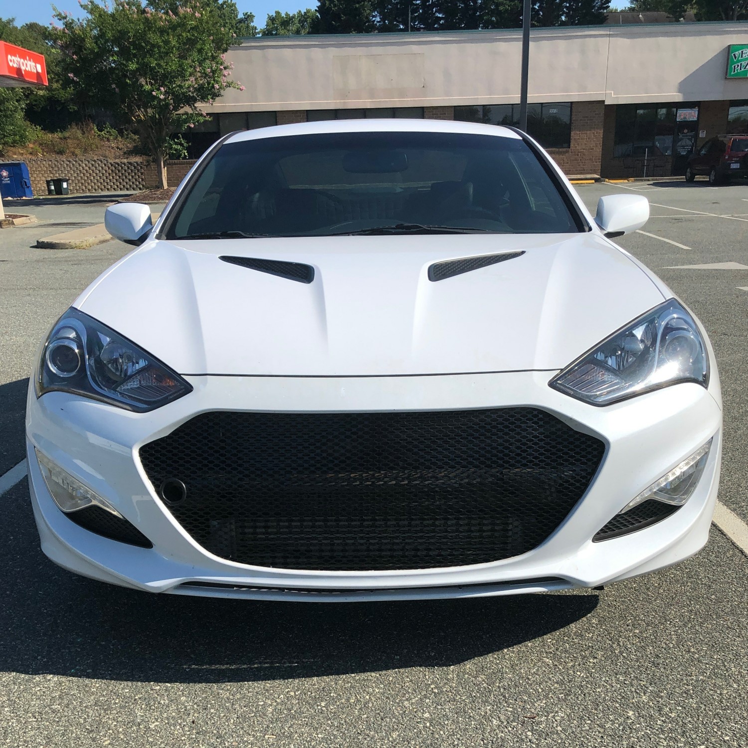 White Hyundai Genesis Coupe with New Mesh Grille: A Stylish Upgrade