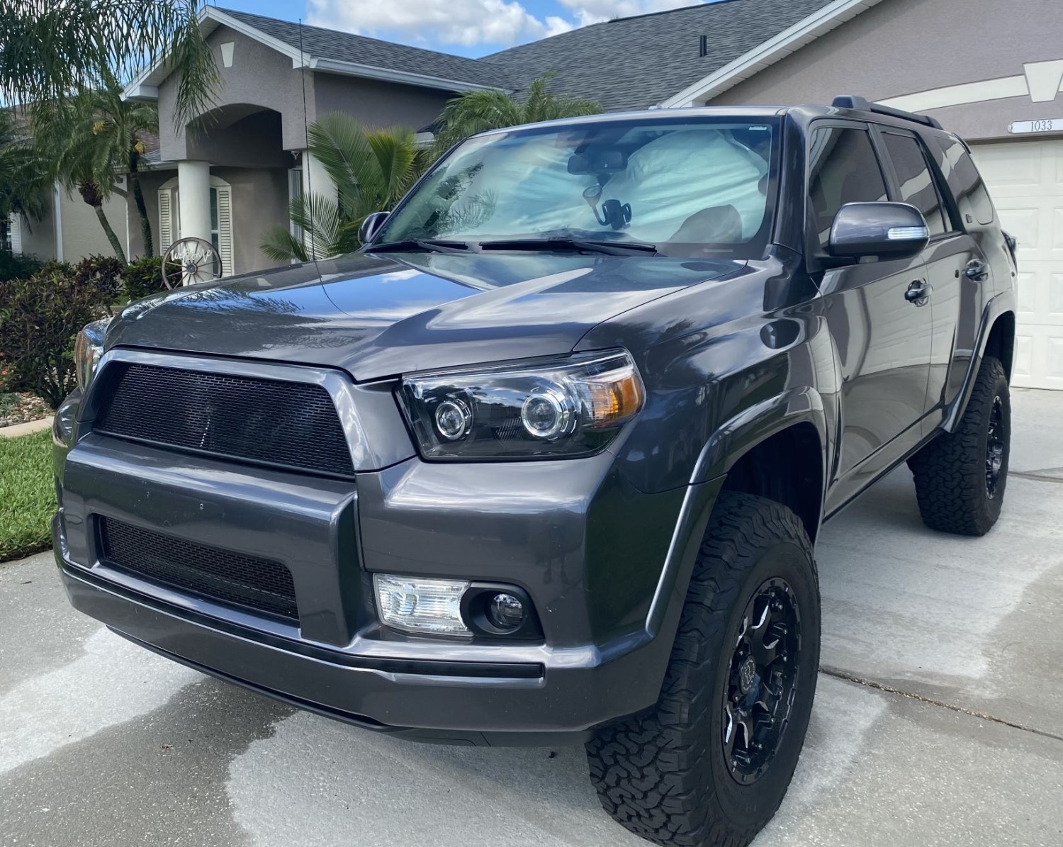 Upgrade Your Toyota 4Runner's Style with a Gloss Black Slotted Mesh Grille and Bumper Set